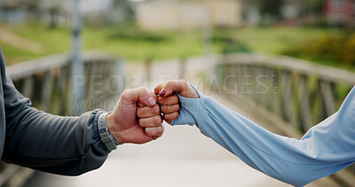 Buy stock photo Friends, fitness and fist bump with hands outdoor for greeting, hello or welcome. Sports, people and gesture together for teamwork, support and collaboration with partnership for wellness on bridge