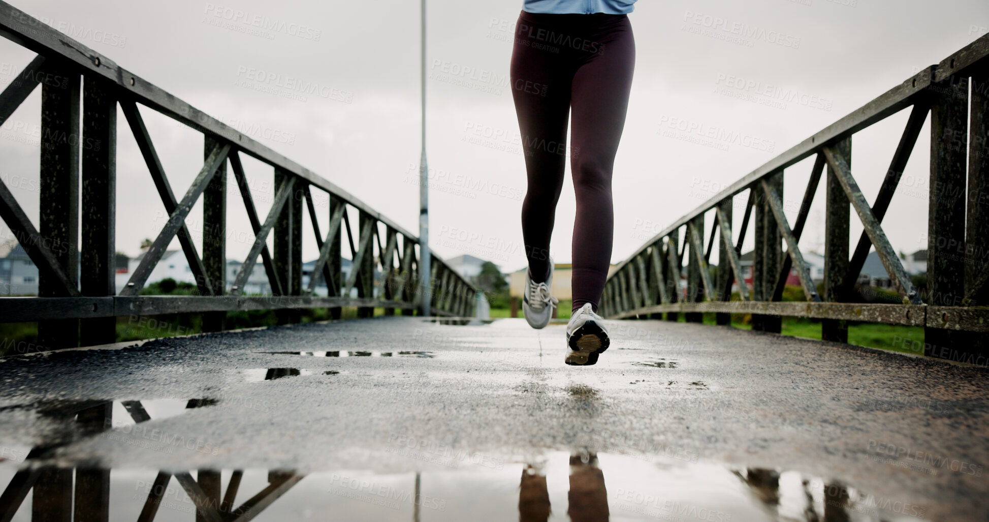 Buy stock photo Fitness, legs and athlete running on bridge for speed training, winter exercise and resilience. Workout, shoes and woman with cardio outdoor for endurance, marathon competition and healthy activity