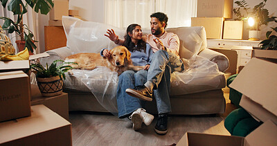 Buy stock photo Couple, dog and talking on sofa in new house for interior design, decoration ideas and planning. Night, people and happy with discussion in first home for renovation, property investment or moving in