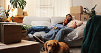 Couple, tired and sleeping on floor in new home for relocation fatigue, security and investment. Moving in, people and resting at night for unpacking burnout, real estate goals and dog friendly house