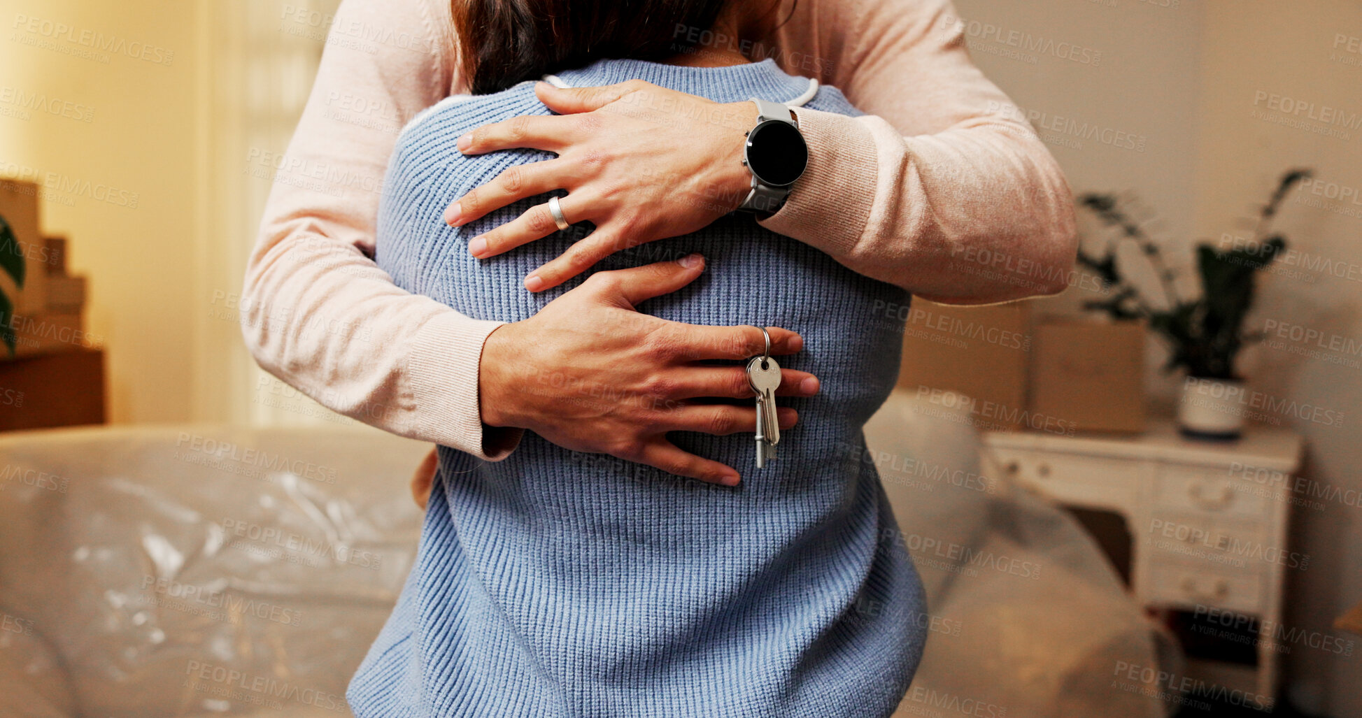 Buy stock photo Love, couple and key for new house, moving and achievement for newlyweds in living room or mortgage. Property investment, people and embrace in home, bonding and boxes for relocation and milestone