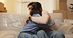 Bonding, couple and hug in new house, love and achievement for newlyweds in living room or mortgage. Investment, home and embrace for milestone, relocation and people in lounge with boxes and moving
