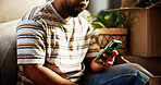 Phone, hands and moving with man in new home for property investment, relocation options or email. Mobile, real estate and person in house with message for rent, mortgage or shop online for furniture