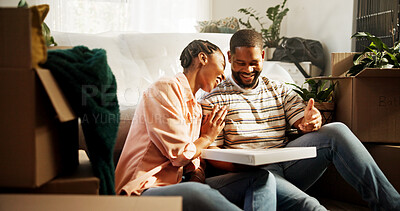 Buy stock photo Pizza, moving and new house of black couple as happy home owners, relocation and eating on break. Man, woman and laughing with food or meal for talk, marriage and purchase of boxes in dream property