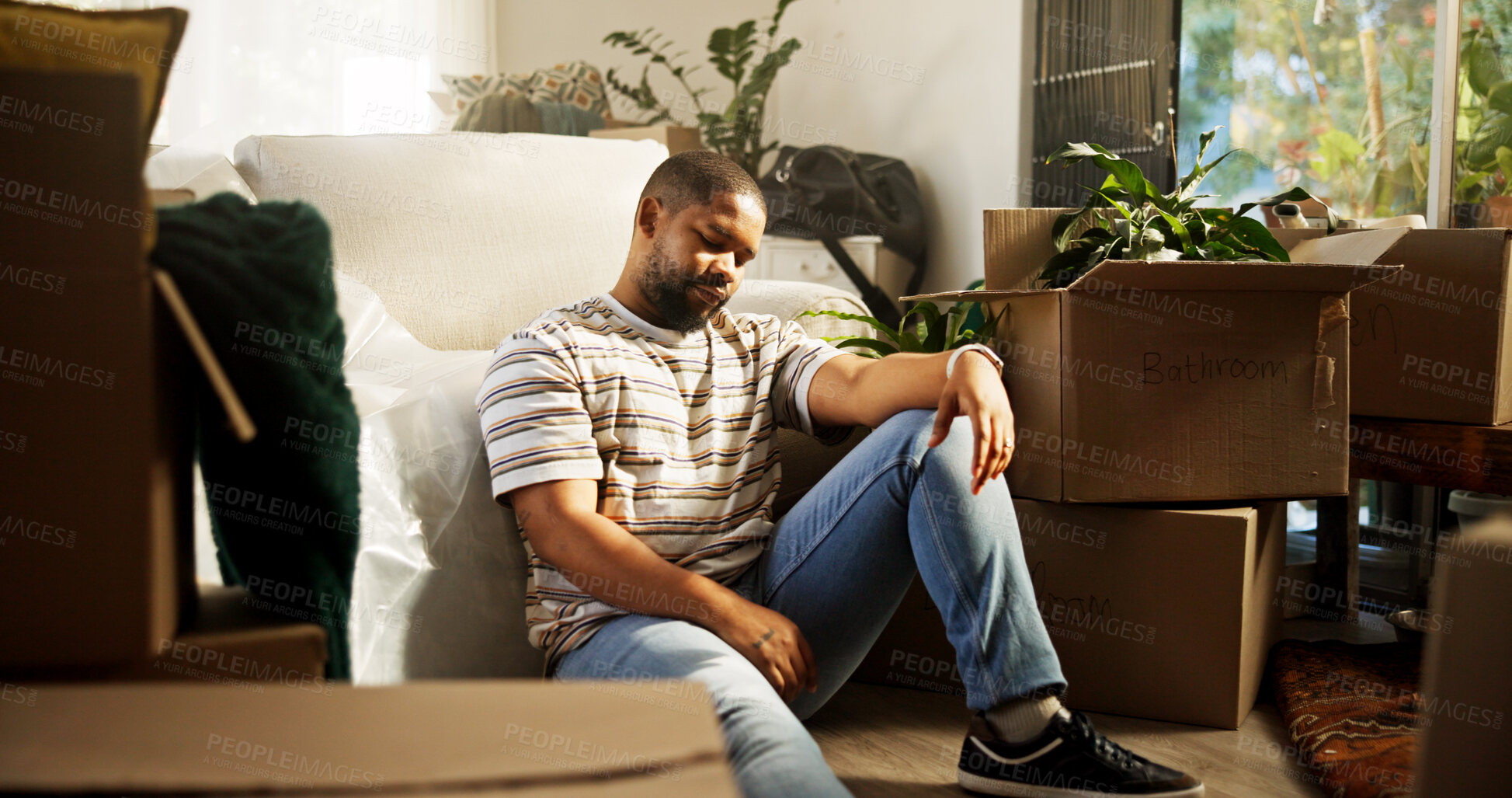 Buy stock photo Sad, man and thinking of eviction, boxes or stress of unemployment, bankruptcy or debt in apartment. Reflection, black person and tenant with anxiety for relocation, cardboard and unhappy in house