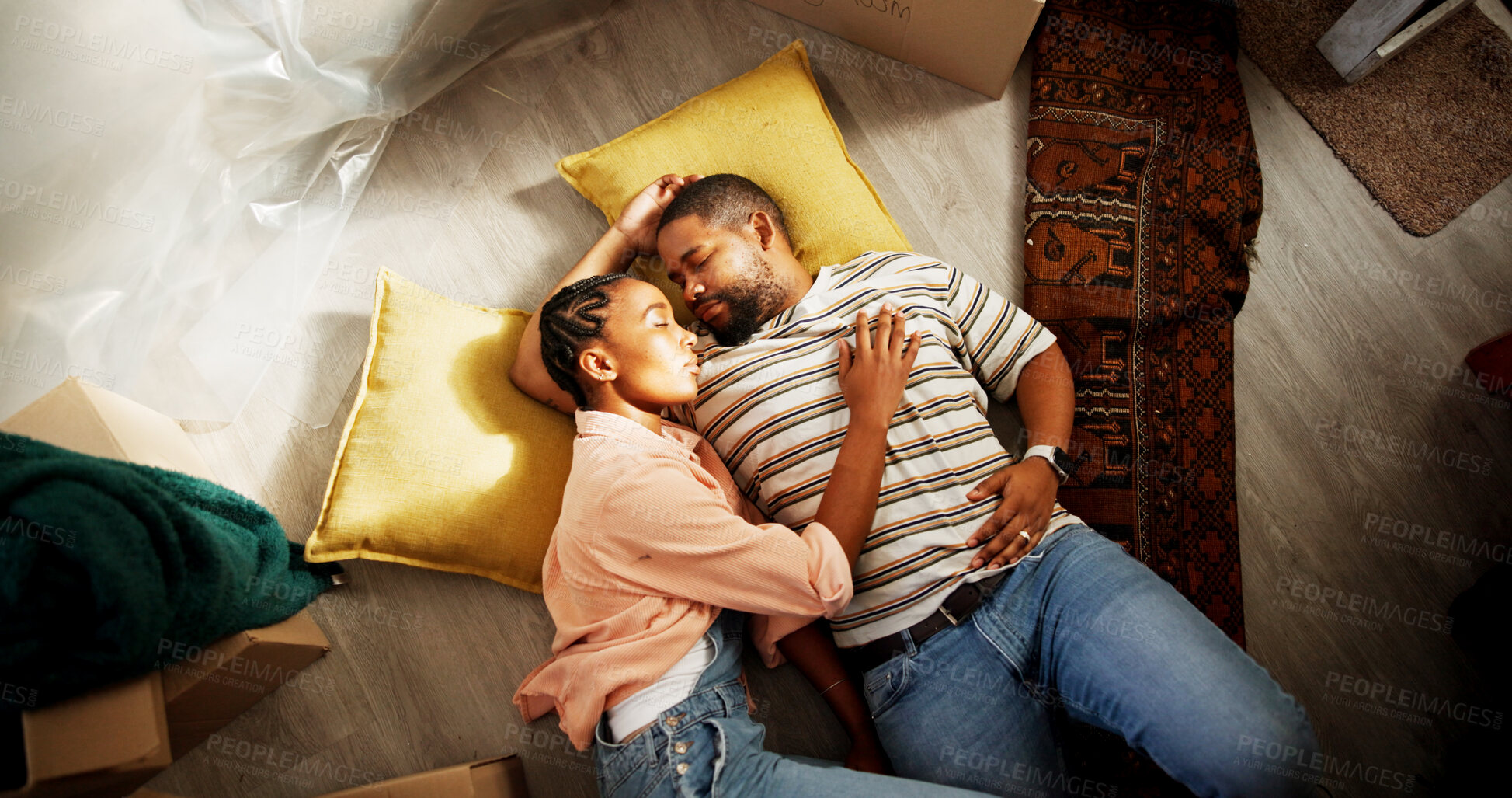 Buy stock photo Above, black couple and sleeping on floor of new home, moving fatigue and exhausted with rest. Tired man, wife and asleep in living room with relocation burnout, support and real estate security
