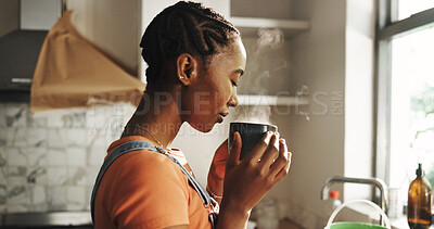 Buy stock photo Sniffing, coffee and woman in kitchen, calm and aroma of hot tea in home, morning or peace on break. Fresh, scent and black person with warm beverage on weekend, relax and smell of caffeine in house