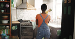 DIY, ideas and paintbrush with black woman in kitchen of new house for maintenance from back. Painting, real estate and thinking with homeowner person in apartment for development or renovation