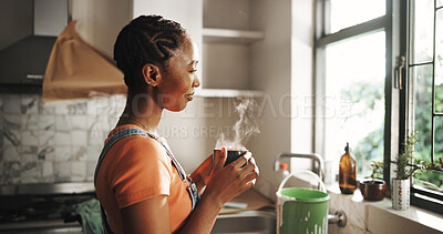 Buy stock photo Thinking, coffee and happy black woman in kitchen for vision, inspiration and peace. Reflection, morning tea and person in home by window with view, daydreaming and decision with steam from drink