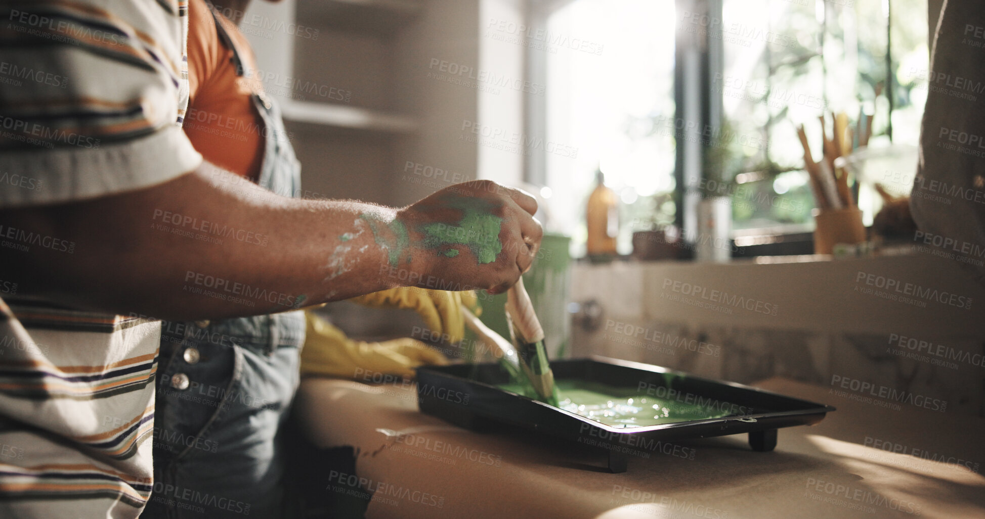 Buy stock photo DIY, hand and painting with person in kitchen of apartment for home improvement or renovation. Maintenance, paintbrush and restoration with homeowner couple in new house for real estate investment