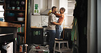 Painting, dance and black couple in home for love, remodeling or bonding together with support. Renovation, happy man and woman with music in kitchen to celebrate house upgrade, romance and embrace