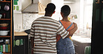 DIY, paintbrush and thinking with black couple in kitchen of new house for maintenance from back. Hug, painting and real estate with homeowner people in apartment for development or renovation