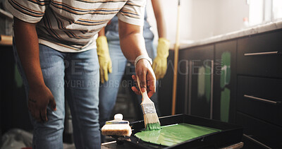 Buy stock photo DIY, hand and paintbrush with person in kitchen of apartment for home improvement or renovation. Maintenance, painting and restoration with homeowner couple in new house for real estate investment