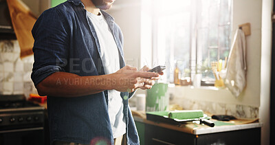 Buy stock photo DIY, hands and phone with man in kitchen of apartment to search for home improvement ideas. App, maintenance and renovation with homeowner in new house for interior design, online planning or texting