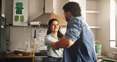 Buy stock photo Dance, DIY and painting with couple in kitchen of apartment together for home improvement. Celebration, music and renovation with people in new house for maintenance, remodeling or restoration