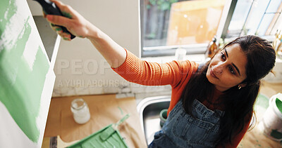 Buy stock photo Above, woman and painting kitchen at new house for renovation, interior design and decoration. Female person, furniture and paint brush for diy improvement, remodeling process and repairs maintenance