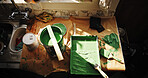 Above, paint and brushes in kitchen for home improvement, interior design and apartment maintenance. Bucket, tray and tools on counter for DIY project, creativity and equipment for house makeover