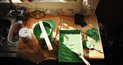Buy stock photo Above, paint and brushes in kitchen for home improvement, interior design and apartment maintenance. Bucket, tray and tools on counter for DIY project, creativity and equipment for house makeover