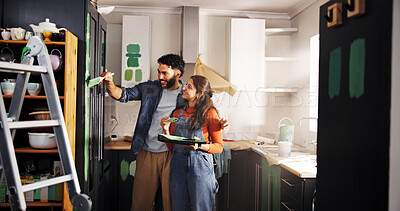 Buy stock photo Diy, painting and renovation with couple in kitchen of apartment together for home improvement. Maintenance, paintbrush and smile with happy people in new house for remodeling, repairs or restoration