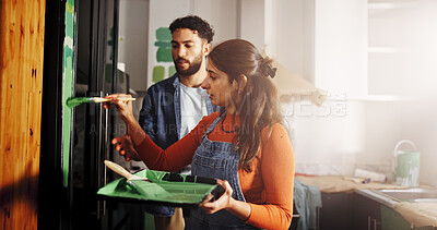 Buy stock photo Diy, maintenance and painting with couple in kitchen of apartment together for home improvement. Paintbrush, renovation and teamwork with people in new house for remodeling, repairs or restoration