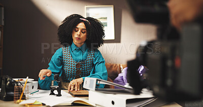 Creative, actor and woman on movie production, cinematography and shooting of scene with technology. Person, acting and equipment for filming on set, cast and serious for entertainment, art or camera