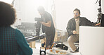 People, filming and cameraman with actress in studio of broadcast, production process and record. Cast, team and cinematographer on set for shooting news, documentary footage and rehearsal backstage

