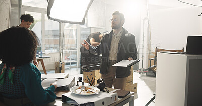 Buy stock photo Actress, conversation and director with script in studio for feedback or instructions on film process. Discussion, production or videography with producer and talent on set for shoot direction