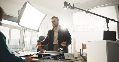 Buy stock photo Conversation, creative and director with actress in studio for feedback or instructions on film process. Media, production or videography with producer and talent on set for shoot directions