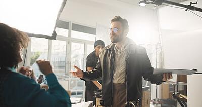 Buy stock photo Director, man and talking to actor, script and practice for take on set, creative and crew for film. Explaining, scene and direction for cinematography, people and instruction for movie or production
