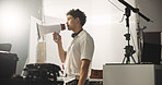 Man, director and megaphone for filming backstage of shooting, acting tips and schedule. Supervisor, speaker and bullhorn with cinematography plan, performance guide and crew feedback for production