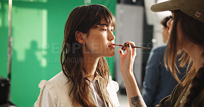 Buy stock photo Set, women and makeup artist with brush, creative and application of cosmetics, preparation or crew. Behind the scene, people and makeover for photoshoot, beauty and getting ready with equipment