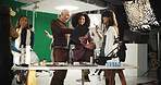 People, actress and filming with clipboard in studio for scene notes, feedback and director advice. Team, makeup and prepare with supervisor for movie production, performance guide and script lines