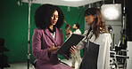 Woman, actress and makeup artist with clipboard in studio for scene notes, feedback and filming advice. Confused, people and bts mistake for movie production, performance guide and script rehearsal
