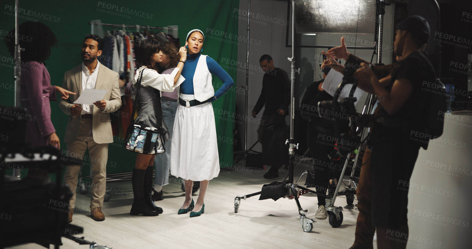 Buy stock photo Actress, woman and makeup artist in production studio for preparation with green screen. Behind the scenes, stylist and cosmetics for beauty with celebrity director for movie set, film or videography