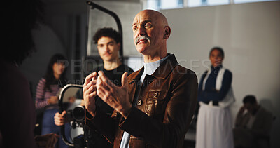 Buy stock photo Director, advice and talking with man on film set for production guide, shooting and discussion. Artistic vision, videography direction and instruction with people in movie studio for performance