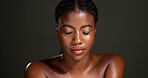 Skincare, glow and eyes closed with woman in studio for beauty, dermatology and self care. Aesthetic, hydration and collagen with person on dark background space for shine, hygiene and clear skin