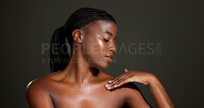 Buy stock photo Skincare, shoulder and African woman in studio for body care, satisfaction and spa wellness. Space, dark background and person with smooth skin, glow and shine for beauty, dermatology and cosmetics
