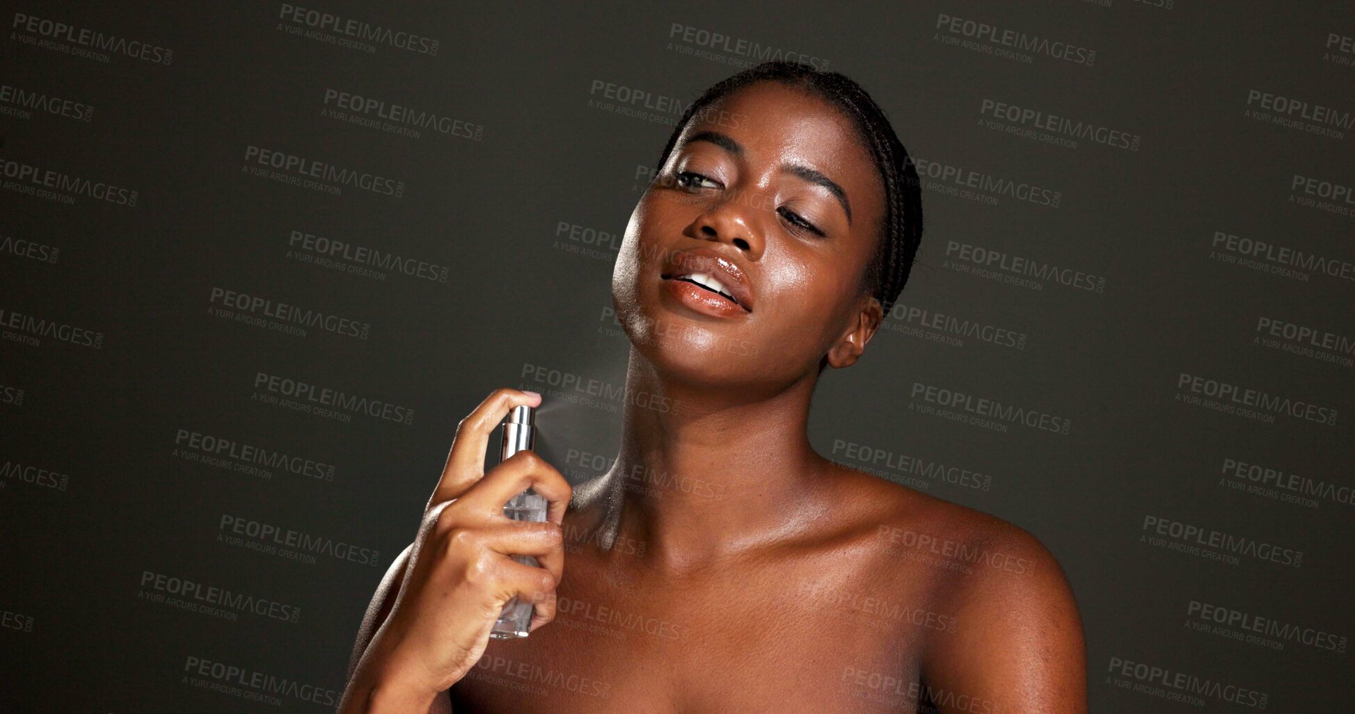 Buy stock photo Black woman, spray and body odor with perfume for fragrance, scent or hygiene on a dark background. Female person, cologne or model with liquid mist or cosmetics for fresh smell or skincare on space