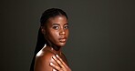 Beauty, shoulder and portrait of black woman in studio for skincare, hydration and glow. Shine, aesthetic and dermatology with person on dark background space for  hygiene, clear skin and body care