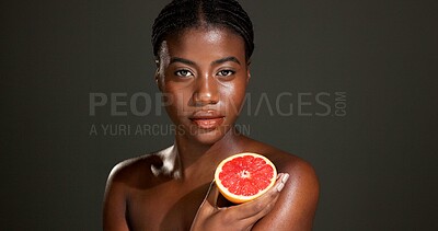 Buy stock photo Black woman, portrait and skincare with grapefruit in studio for beauty on a dark background. Face, female person or African model with natural organic fruit for vitamin C or body health on space