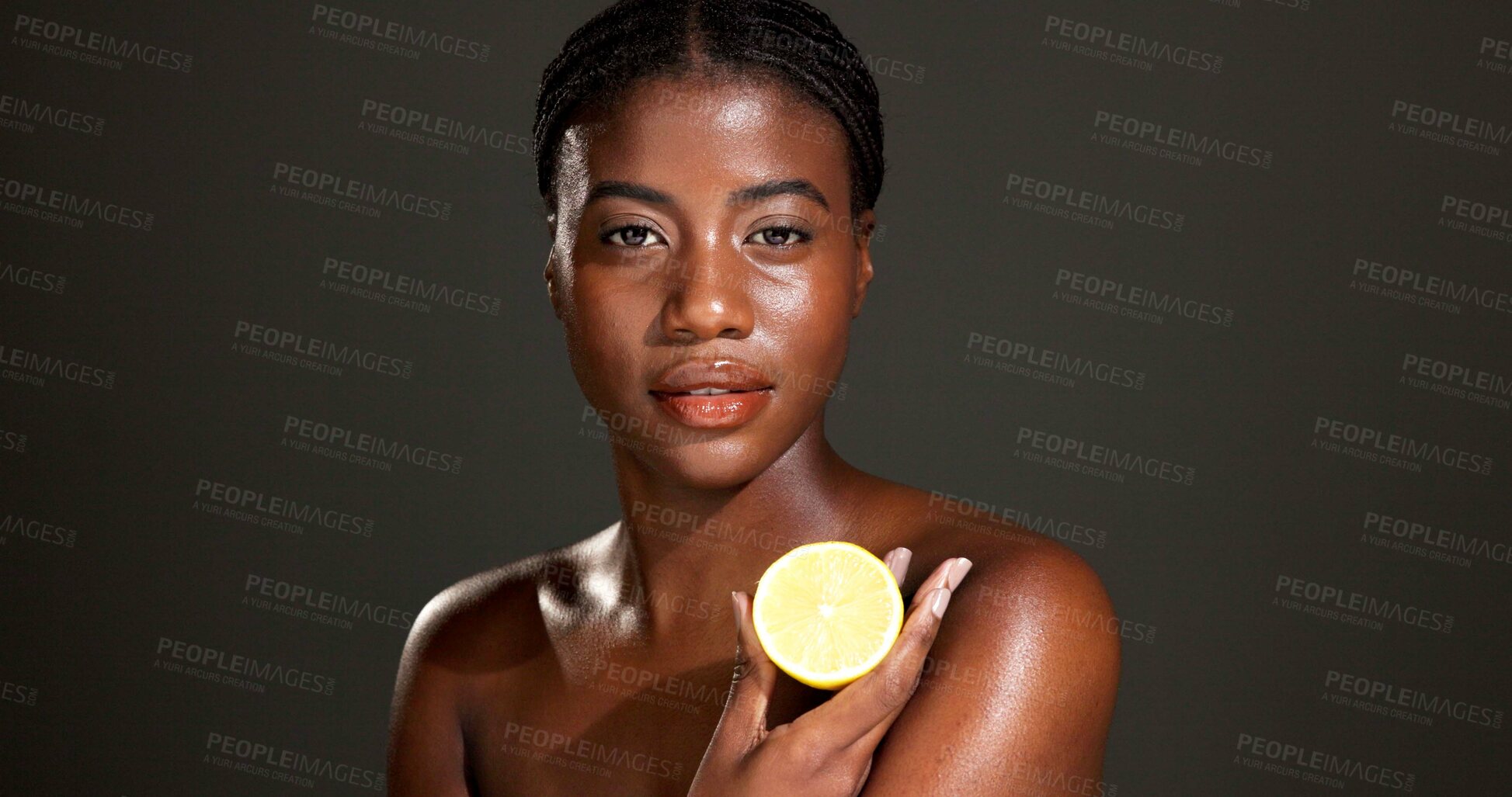 Buy stock photo Black woman, portrait and skincare with lemon in studio for beauty on a dark background. Face, female person or African model with natural organic citrus fruit for vitamin C or body health on space