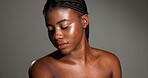 Skincare, glow and African woman in studio for body care, satisfaction and spa wellness. Space, gray background and person with smooth skin, beauty and shine for hydration, dermatology and cosmetics