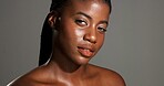 Portrait, skincare and woman with treatment for wellness, glow and pride for healthy skin and shine. Studio, black person and confident for self care with dermatology, gray background or anti aging