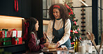 Baking, mother and child with smile on Christmas for festive dessert recipe, mix batter and help. Happy family, people and dough ingredients in home for xmas cookies, holiday celebration and learning