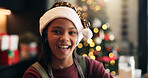 Christmas, smile and portrait of child in home for holiday season, festive celebration and bokeh. Xmas tradition, happiness and cheer with girl and santa hat in family house for event and break
