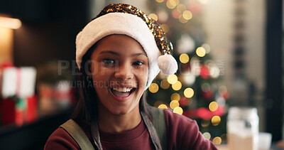 Buy stock photo Christmas, smile and portrait of child in home for holiday season, festive celebration and bokeh. Xmas tradition, happiness and cheer with girl and Santa hat in family house for event and break