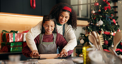 Buy stock photo Christmas, baking and rolling pin with family in kitchen of home together for festive tradition. Cooking, people or smile with daughter and single parent mother in apartment for holiday celebration