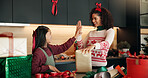 Mother, high five and child with present for Christmas preparation, wrapping gift and bonding. Smile, woman and kid help for giving package, family support and celebrate of festive tradition at house