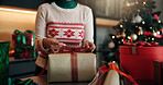 Hands, ribbon and woman with Christmas gift for holiday tradition, celebration and party event. Preparation, person and packaging box in house with present decoration, festive season and appreciation