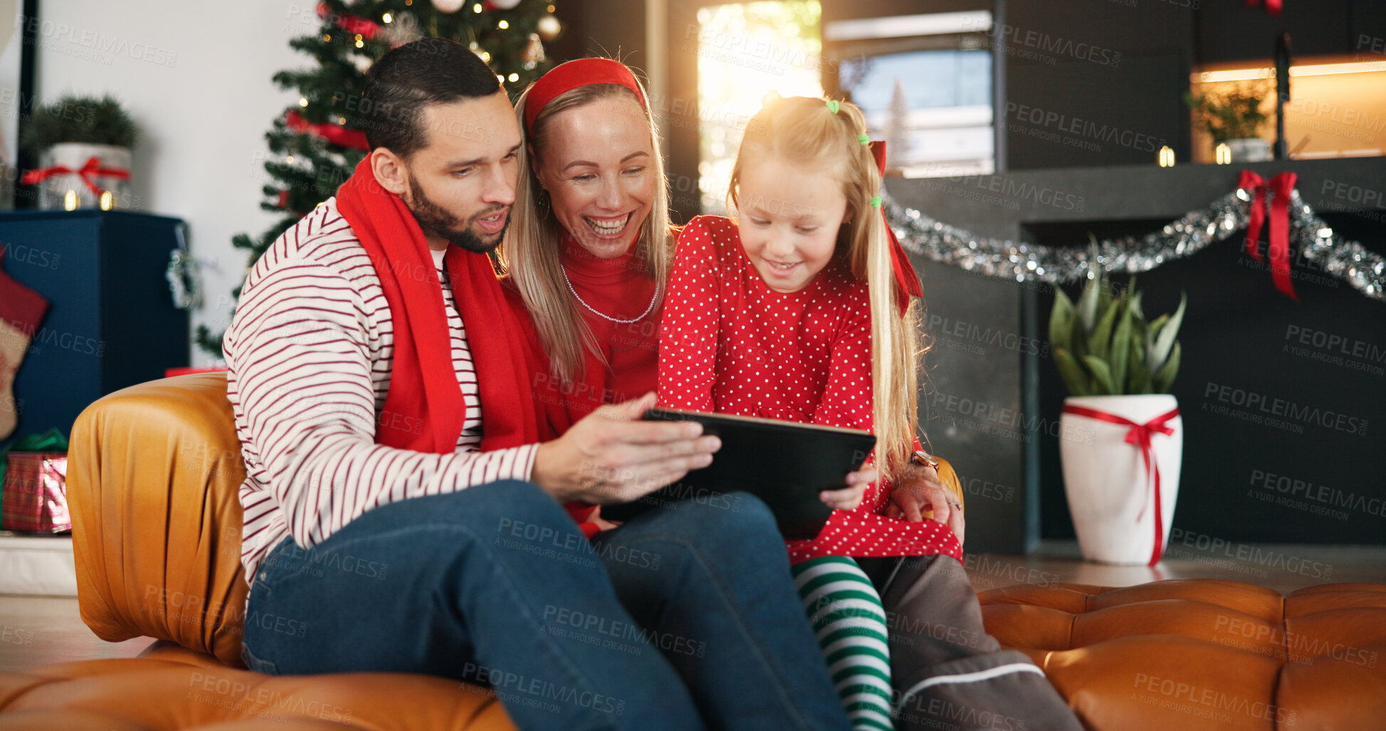 Buy stock photo Child, happy family and parents with tablet for Christmas film, gift shopping and festive cartoon. Tech, mother and father with girl for xmas, funny movie and present choice on internet in home